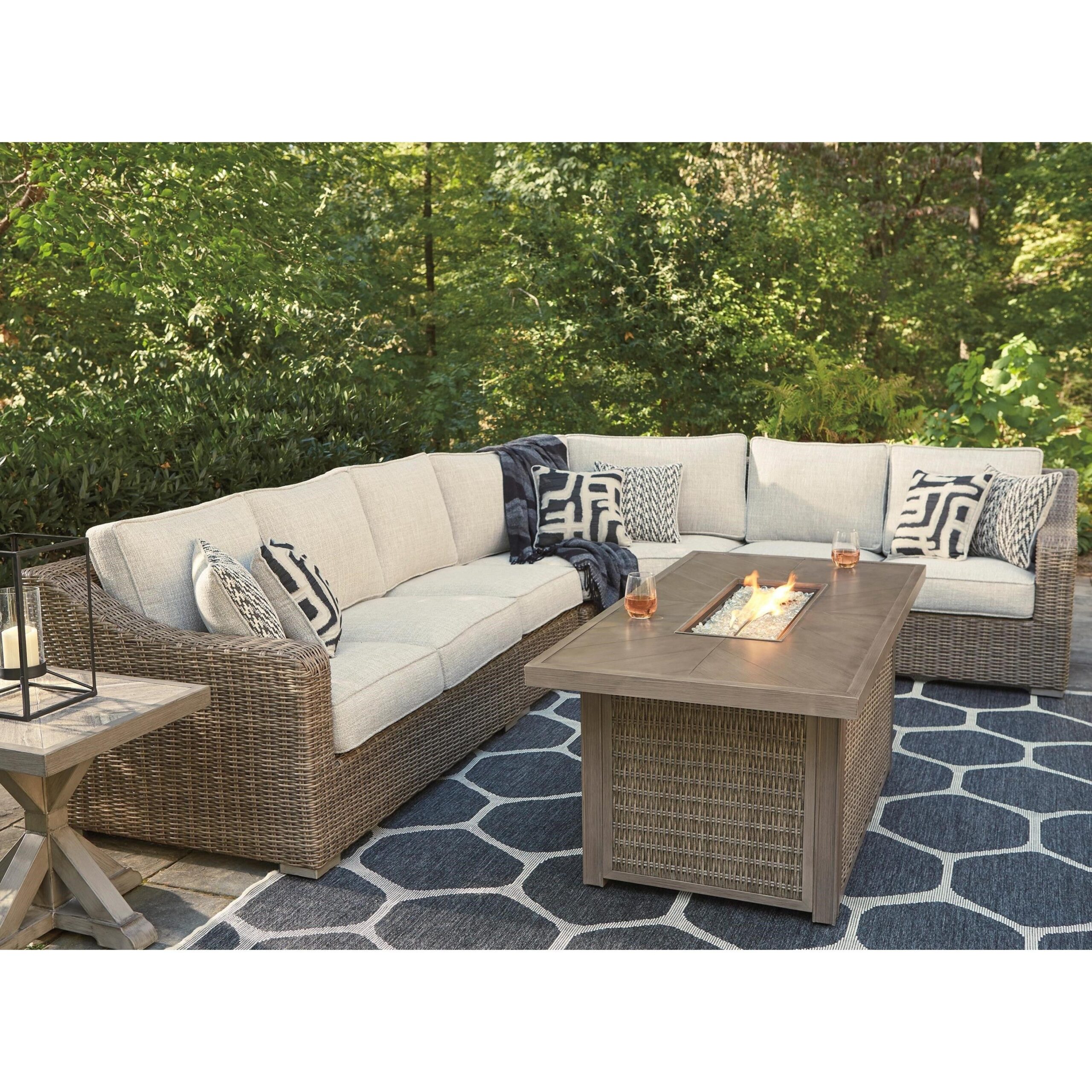 Outdoor lounge seating arranged around a fire table